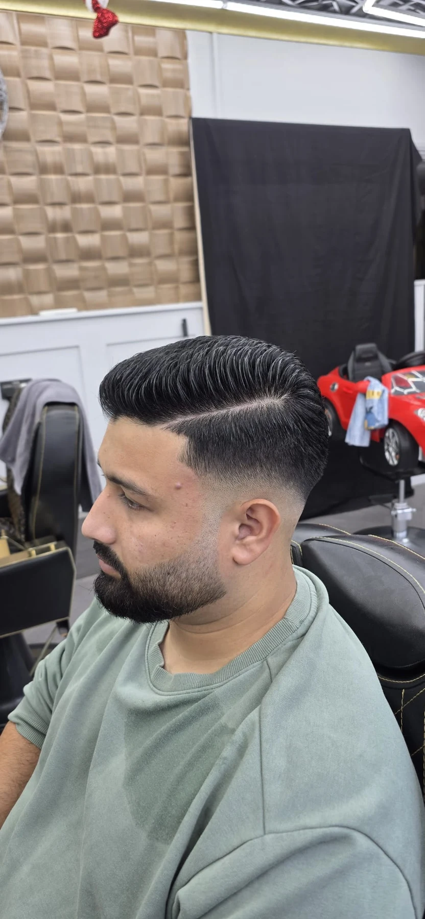 Side view of a skin fade with a shaped beard
