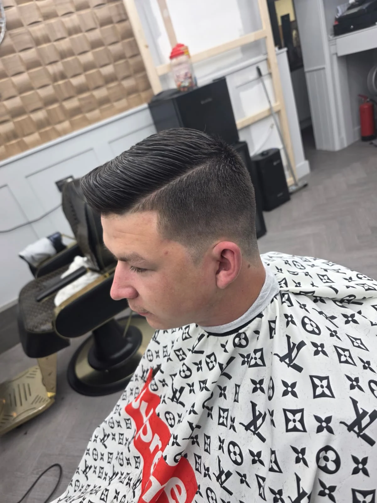 Side-parted haircut with closely faded sides