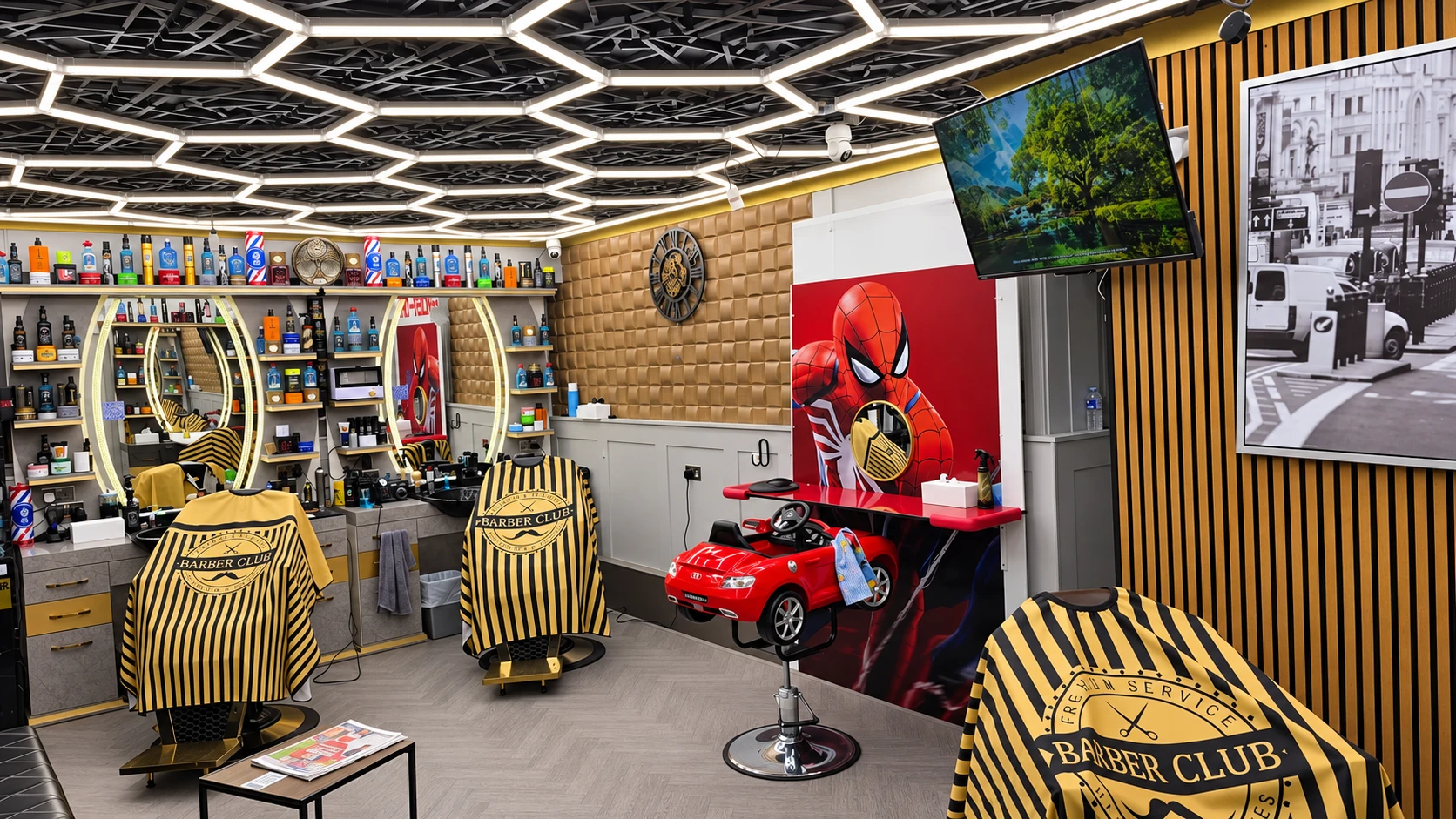 Tito's Barber interior with hexagonal ceiling lights, illuminated mirrors and the red kids' chair